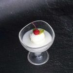 CHILLED COCONUT PUDDING WITH VANILA ICE CREAM TOPPED WITH MINT LEAF