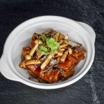 PAN FRIED HALIBUT FISH FILLET WITH WHITE ONION IN TERIYAKI SAUCE SERVE IN CLAYPOT 